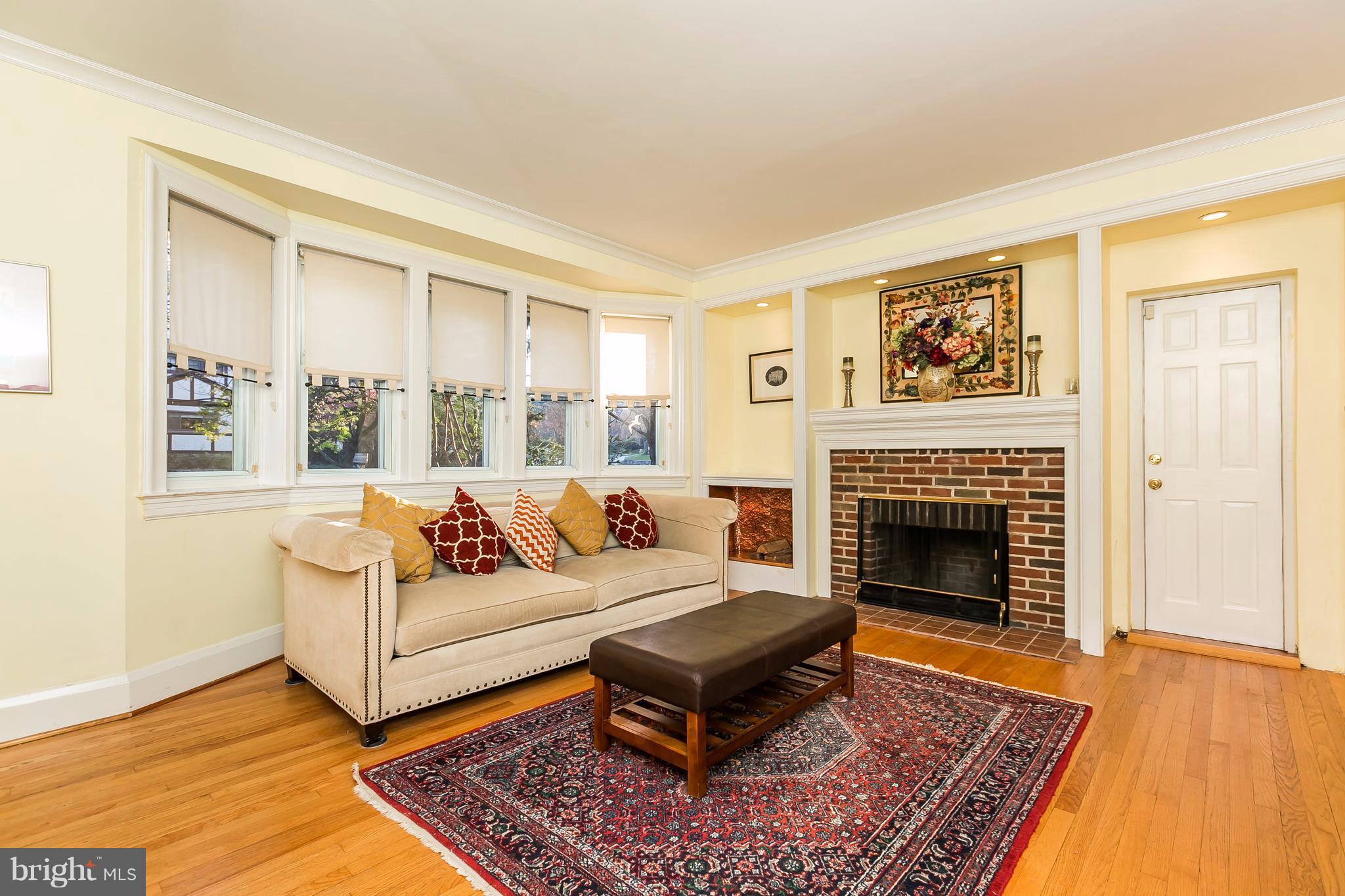 2412 Brambleton Road Baltimore, MD 21209 - Photo 3 of 30 a living room with furniture and a fireplace