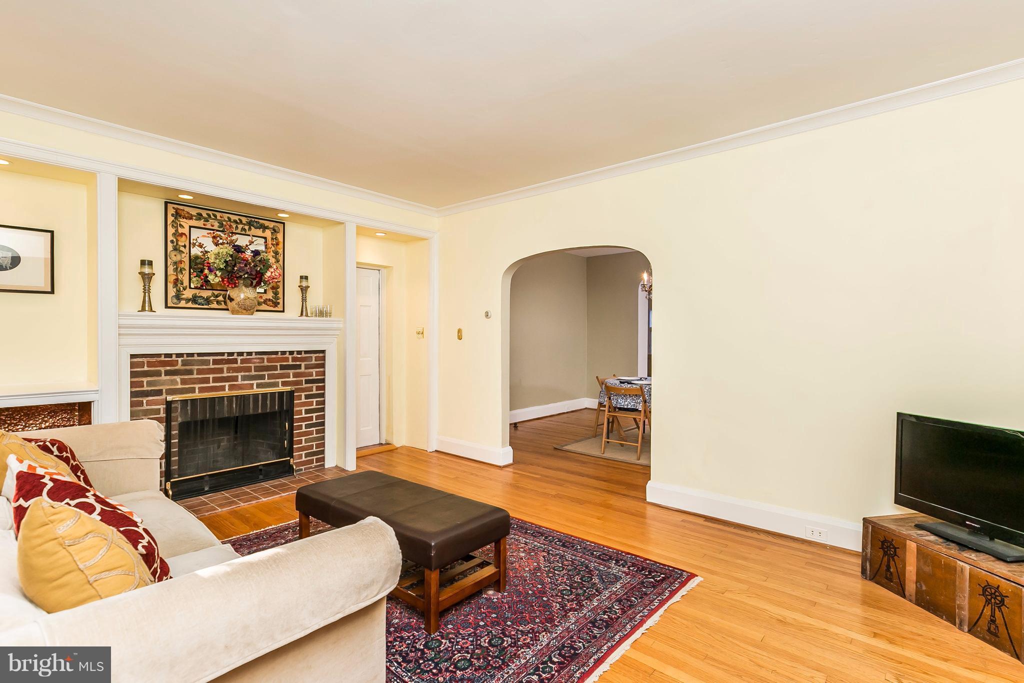 2412 Brambleton Road Baltimore, MD 21209 - Photo 4 of 30 a living room with furniture and a fireplace
