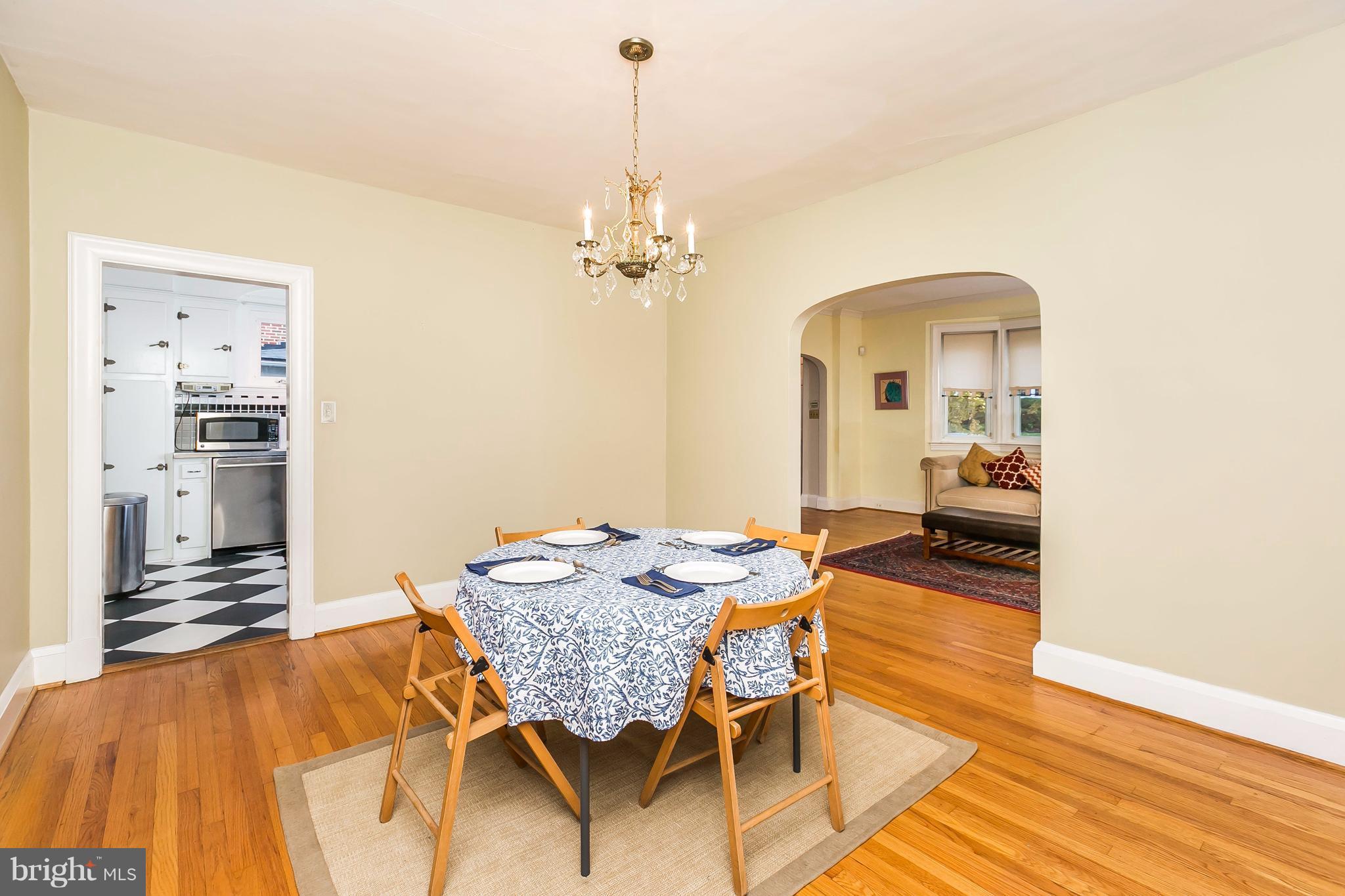2412 Brambleton Road Baltimore, MD 21209 - Photo 5 of 30 a view of a dining room with furniture and wooden floor