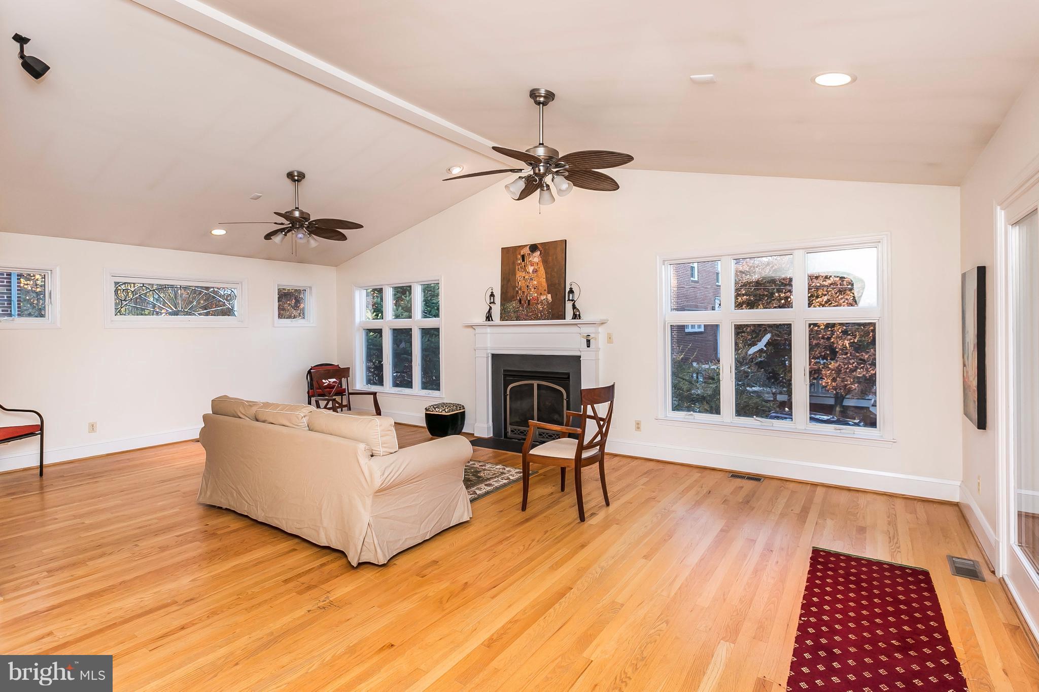 2412 Brambleton Road Baltimore, MD 21209 - Photo 8 of 30 a living room with furniture and a fireplace