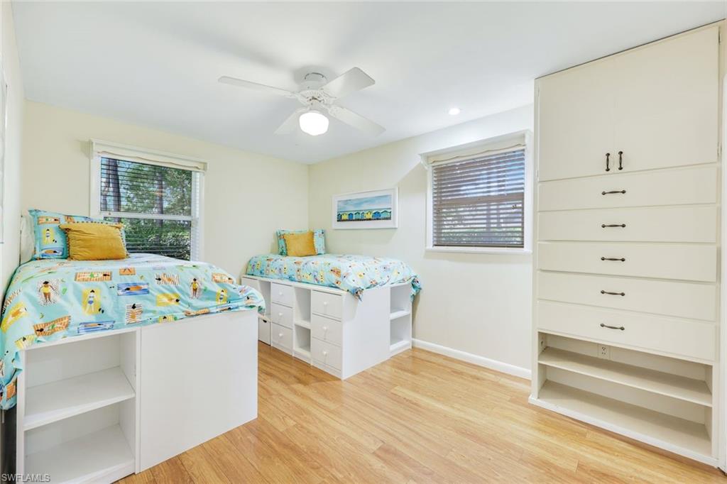 131 Cajeput Drive Naples, FL 34108 - Photo 16 of 30 a bedroom with a bed and a dresser
