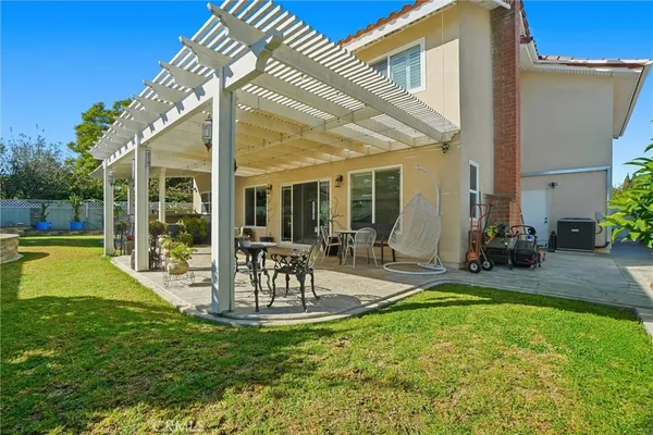 a view of a patio with a table and chairs