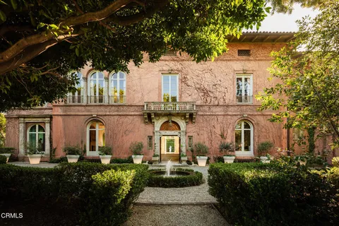front view of a house with a garden