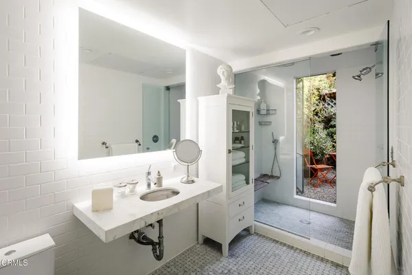 a bathroom with a sink and mirror