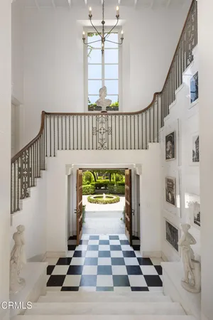 a view of an entryway with wooden floor