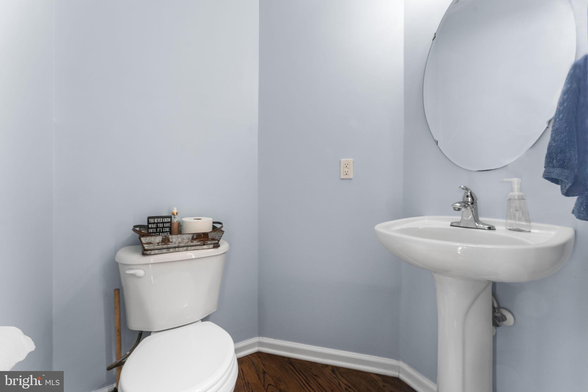 5219 Joshua Tree Circle Fredericksburg, VA 22407 - Photo 16 of 42 a bathroom with a toilet sink and mirror