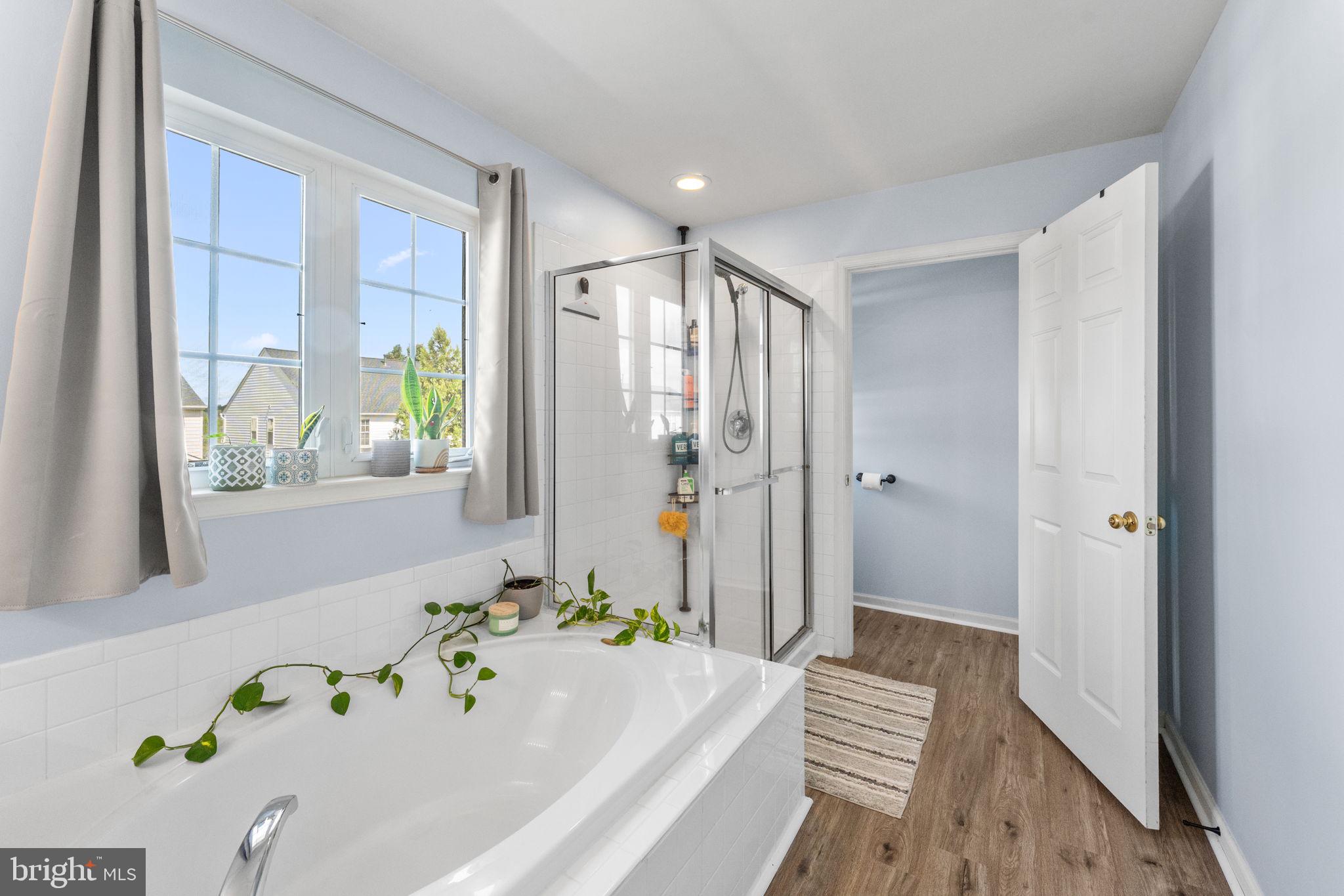 5219 Joshua Tree Circle Fredericksburg, VA 22407 - Photo 20 of 42 a bathroom with a bathtub and a shower