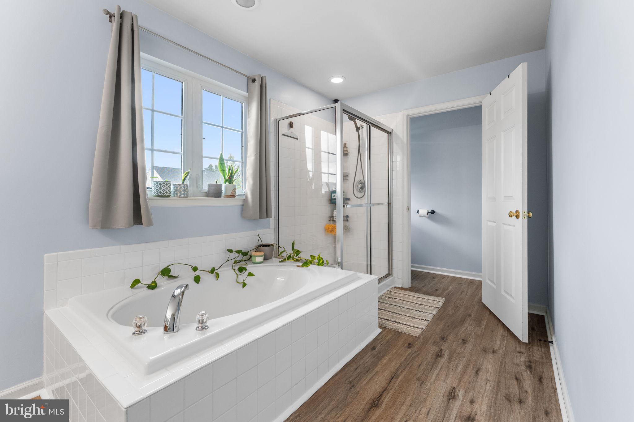 5219 Joshua Tree Circle Fredericksburg, VA 22407 - Photo 21 of 42 a bathroom with a tub sink and mirror