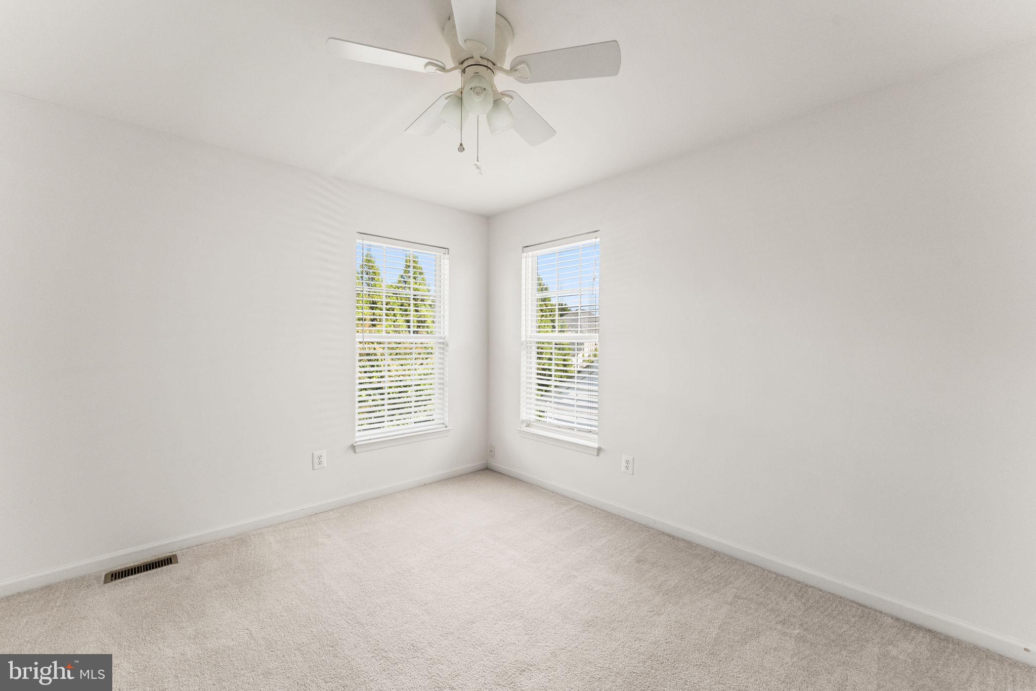 5219 Joshua Tree Circle Fredericksburg, VA 22407 - Photo 23 of 42 an empty room with windows and fan