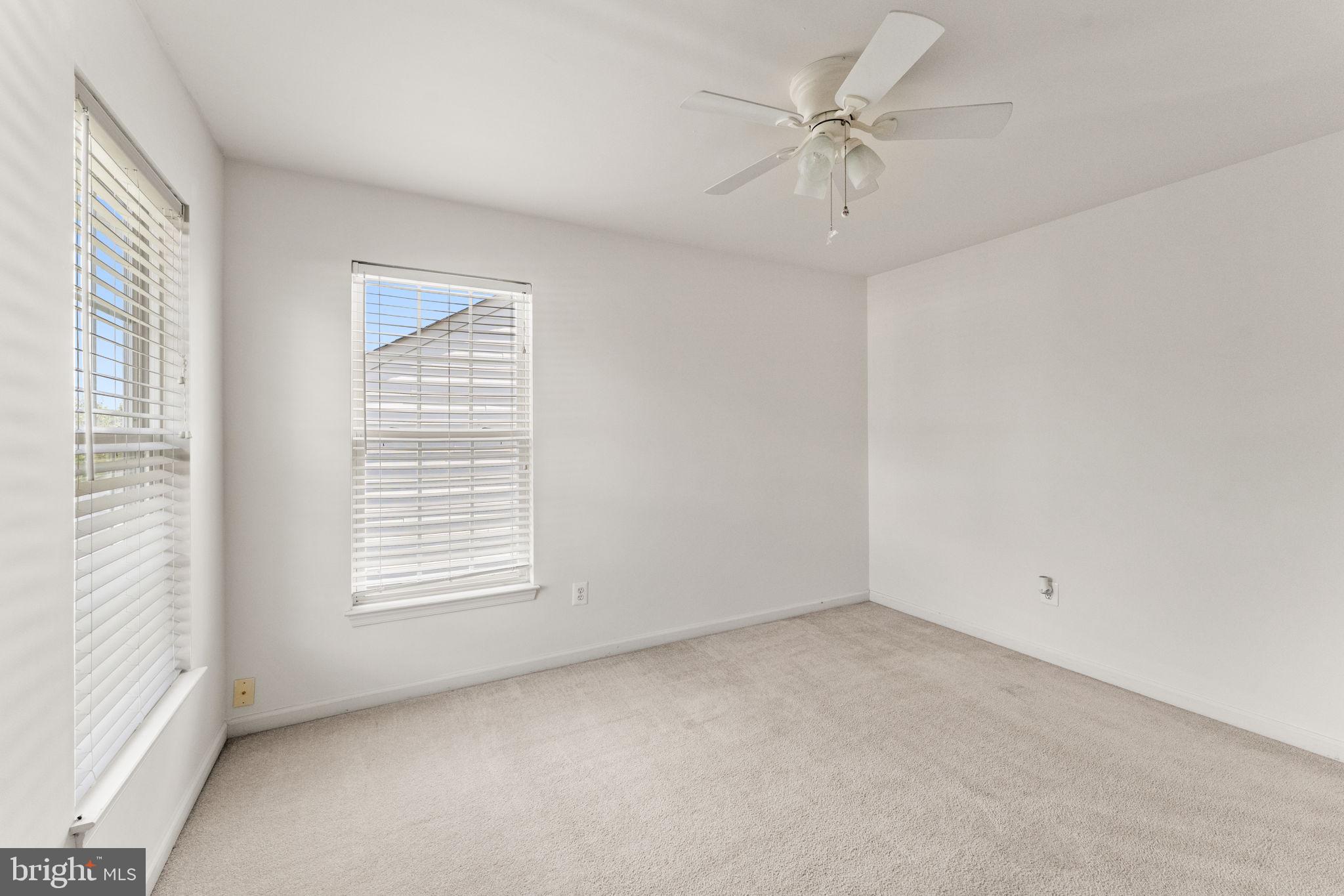 5219 Joshua Tree Circle Fredericksburg, VA 22407 - Photo 25 of 42 an empty room with windows and fan