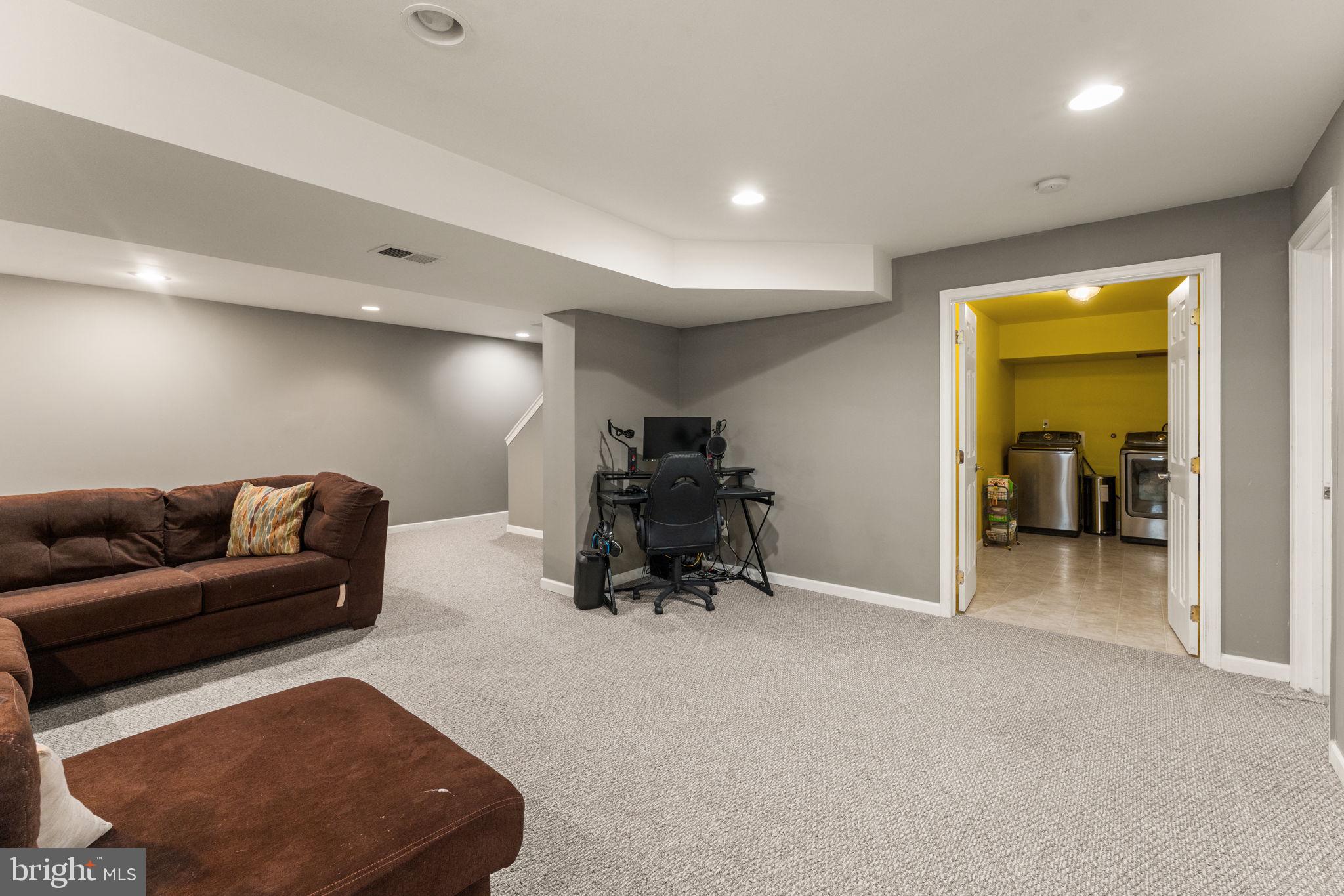 5219 Joshua Tree Circle Fredericksburg, VA 22407 - Photo 33 of 42 a livingroom with furniture and a gym equipment