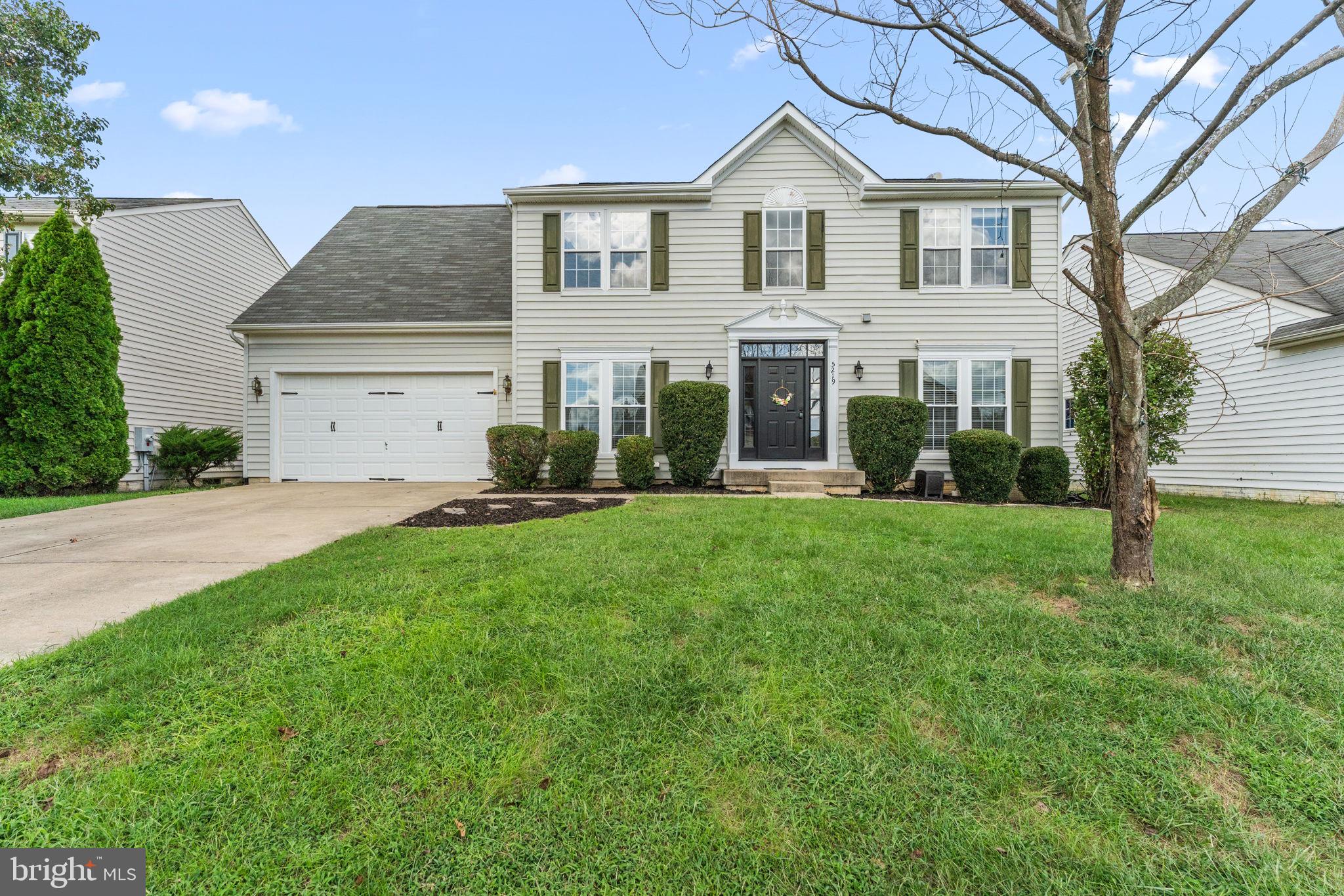 5219 Joshua Tree Circle Fredericksburg, VA 22407 - Photo 38 of 42 a front view of a house with a yard