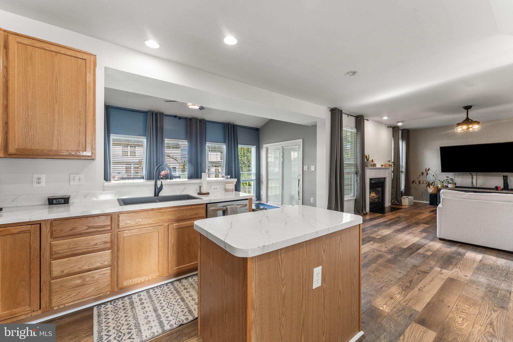 5219 Joshua Tree Circle Fredericksburg, VA 22407 - Photo 10 of 42 a large kitchen with kitchen island a sink a counter space and stainless steel appliances
