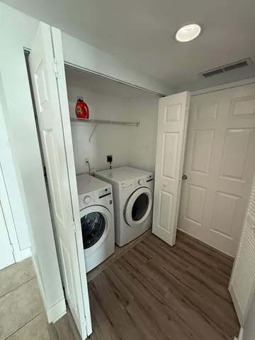 a bathroom with a toilet a sink and a mirror