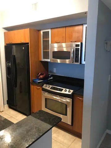 a kitchen with a stove and a refrigerator