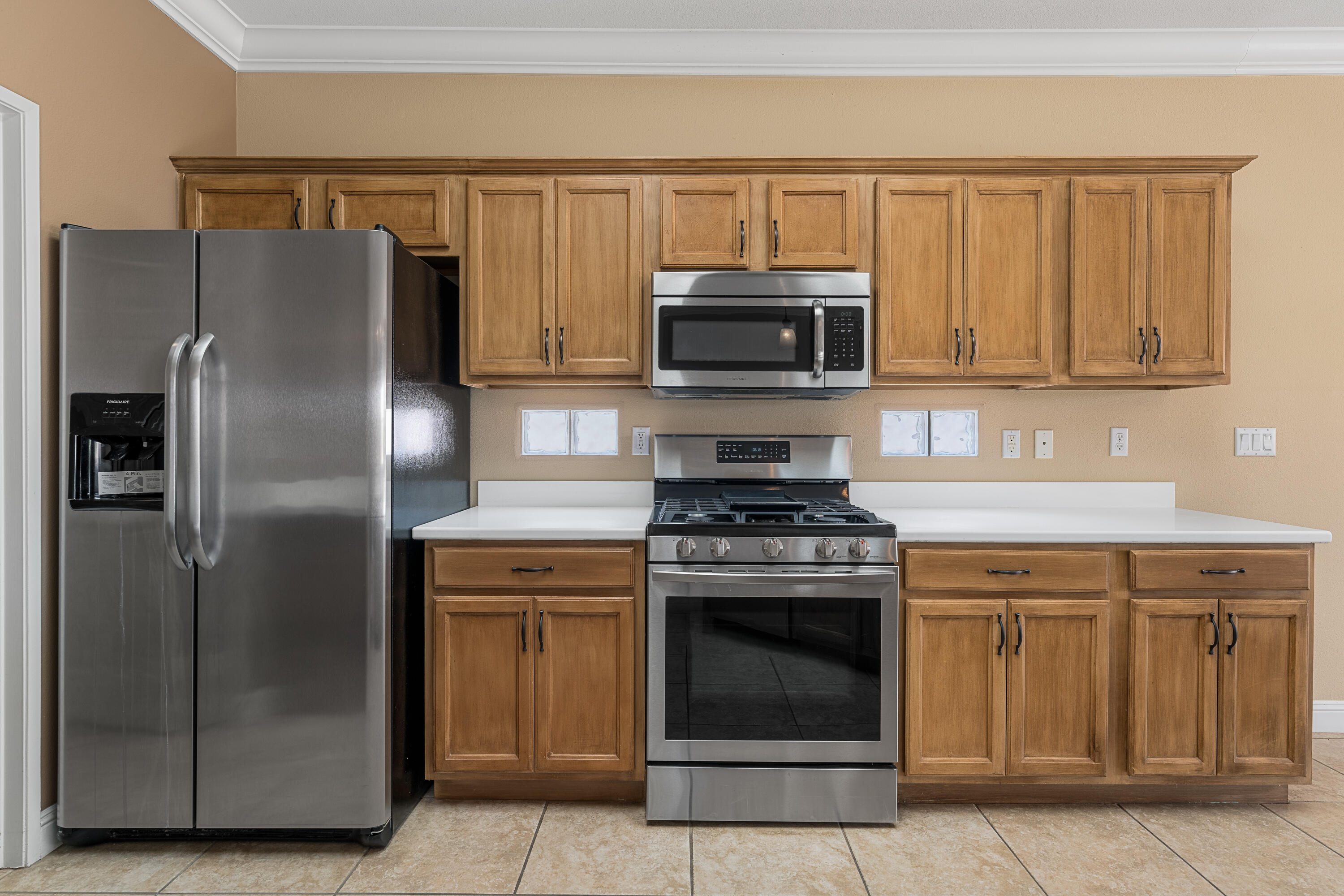 36403 Monarch Pass Palm Desert, CA 92211 - Photo 16 of 32 a kitchen with a stove microwave and refrigerator