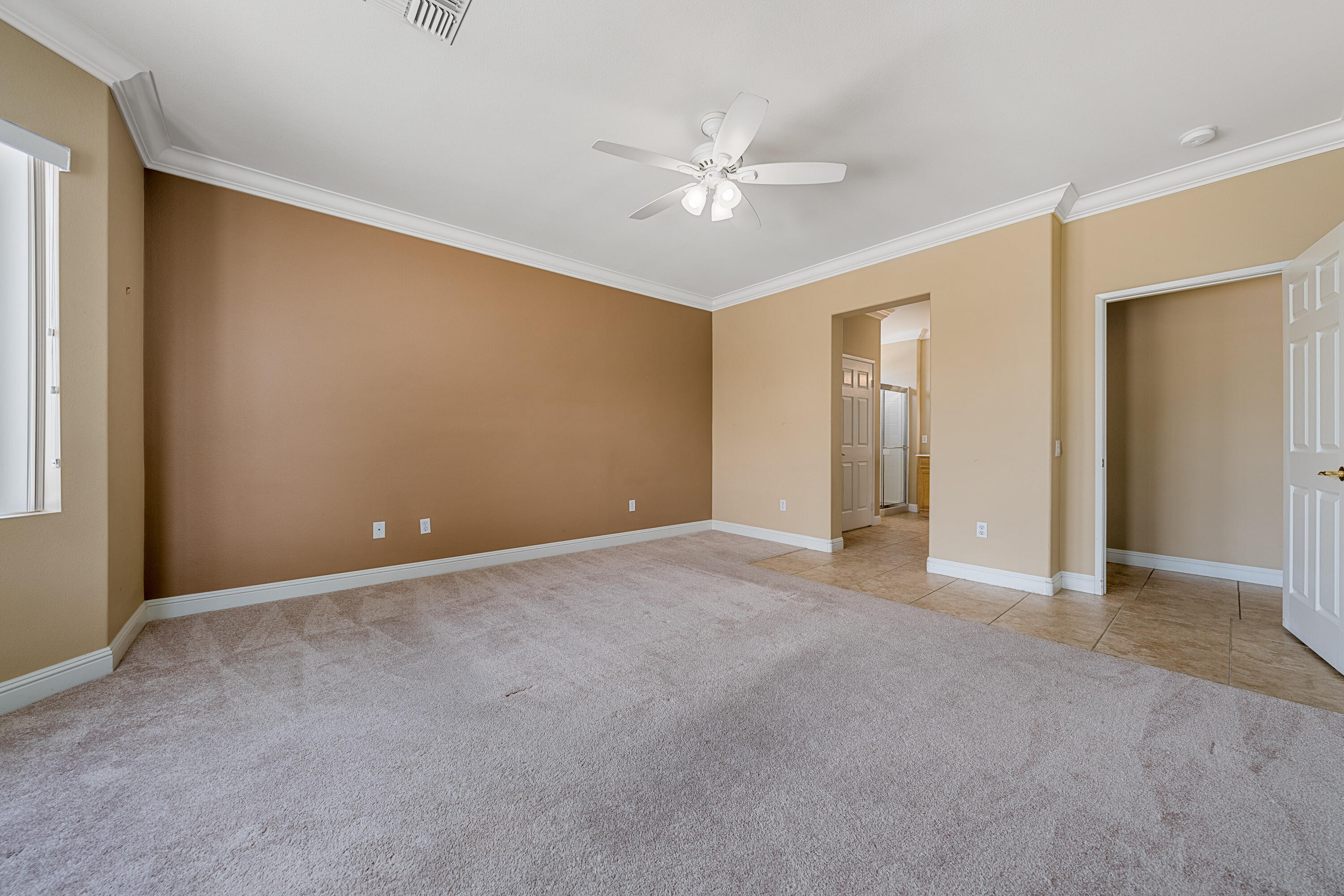 36403 Monarch Pass Palm Desert, CA 92211 - Photo 25 of 32 a view of an empty room with a fan