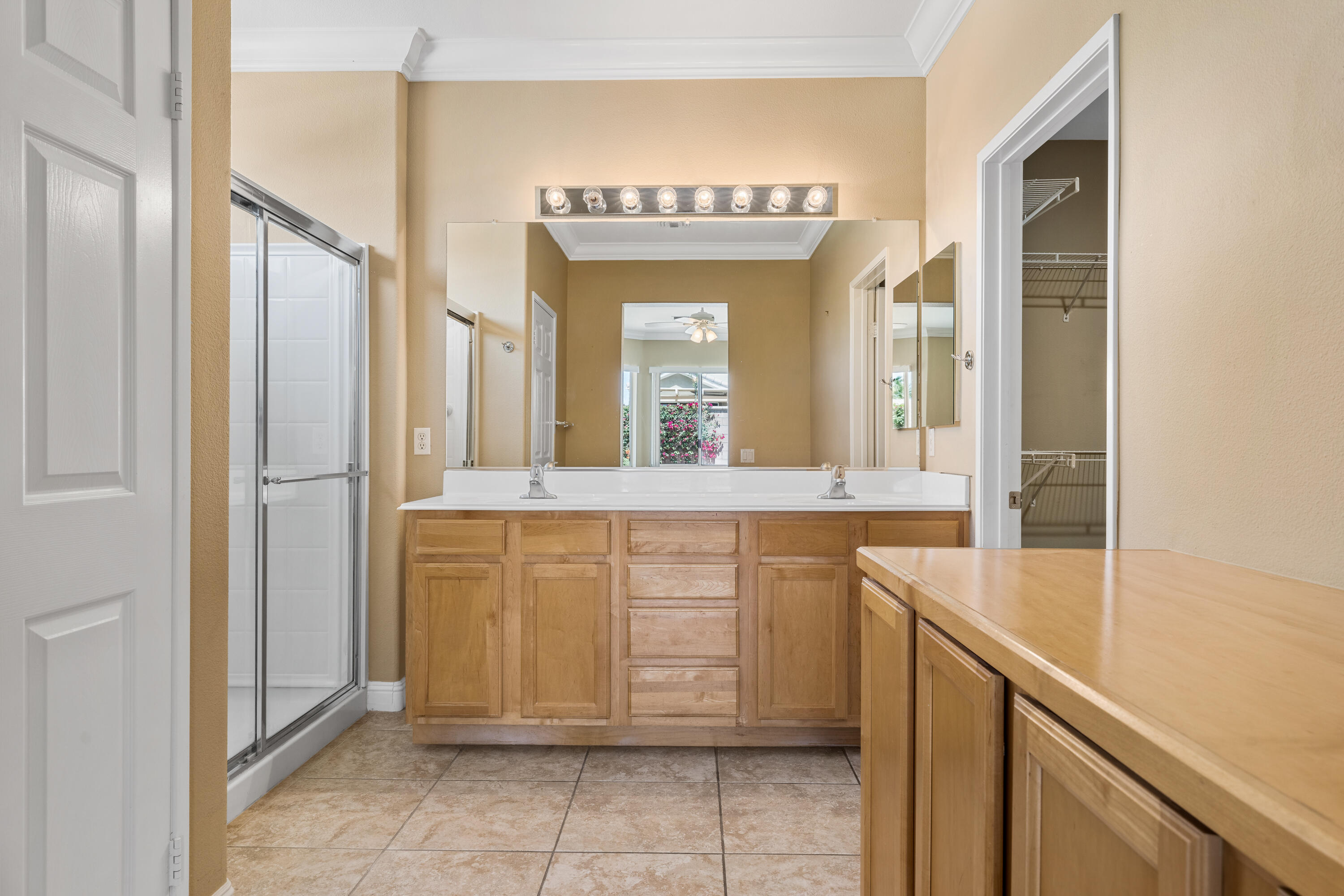 36403 Monarch Pass Palm Desert, CA 92211 - Photo 27 of 32 a bathroom with a sink vanity and a mirror