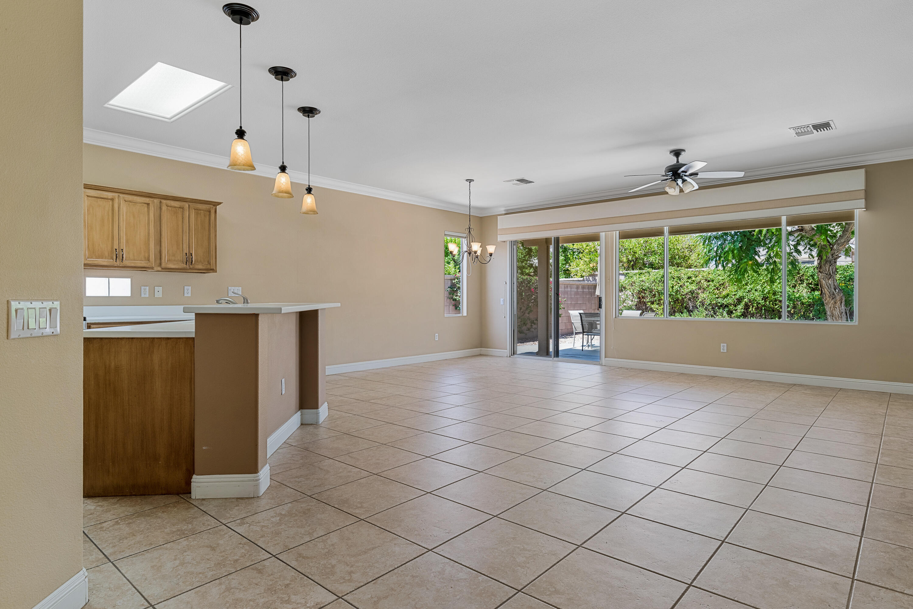 36403 Monarch Pass Palm Desert, CA 92211 - Photo 8 of 32 a view of a kitchen with furniture and windows