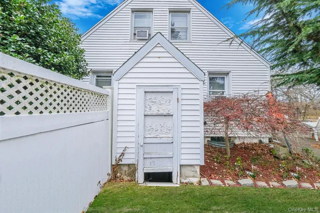 a view of front of house with a yard