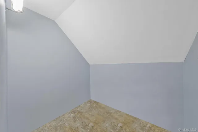 a bedroom with a bed and flat screen tv