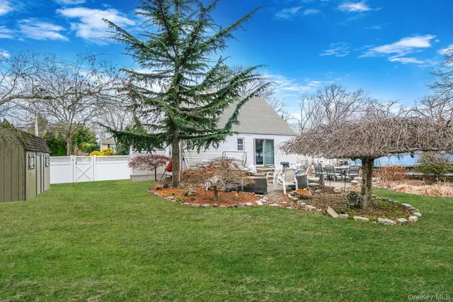 a view of a house with backyard porch and sitting area