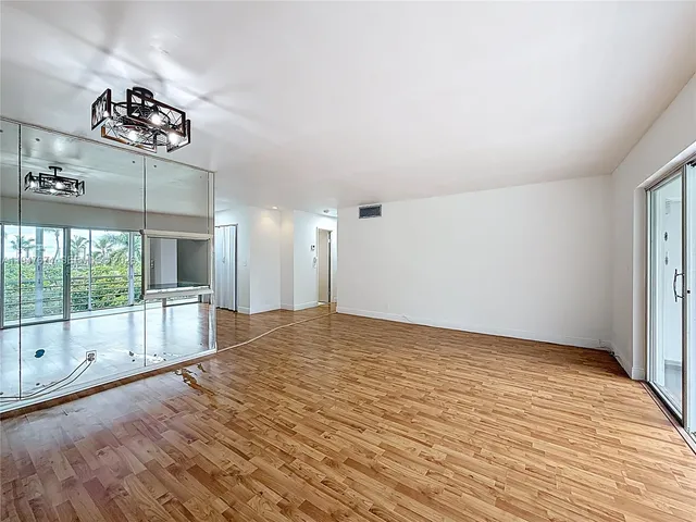 a view of a living room and a large window