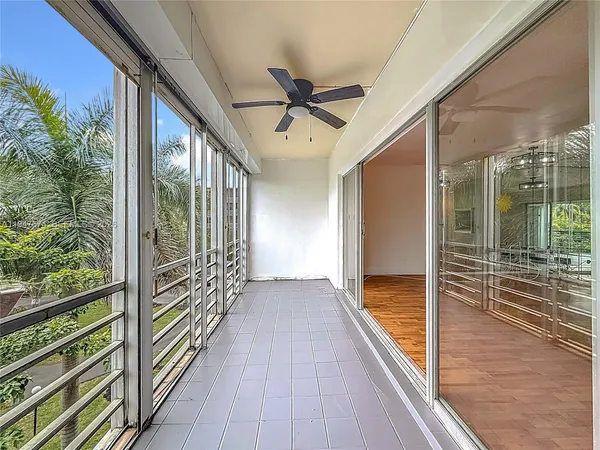 a view of a balcony with chairs