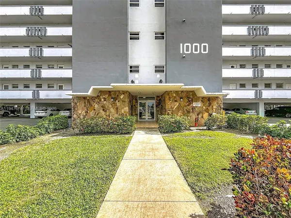 a front view of a building with community park