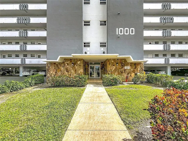 a front view of a building with community park