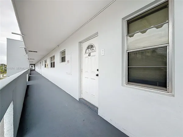 a view of a hallway with staircase