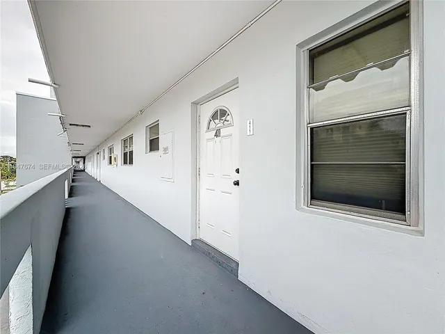 a view of a hallway with staircase