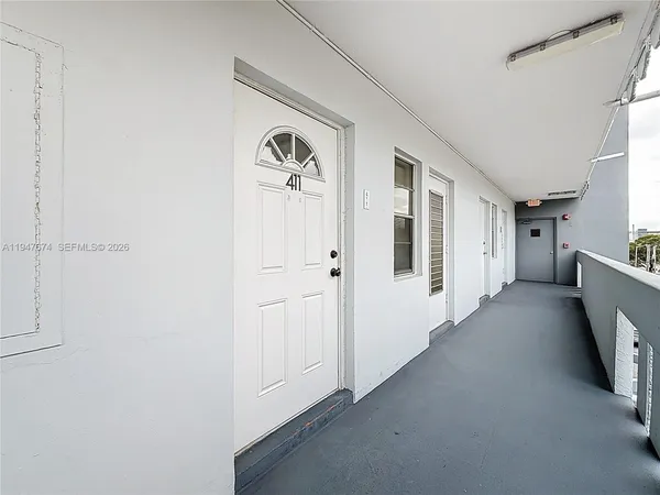 a view of a hallway with closet