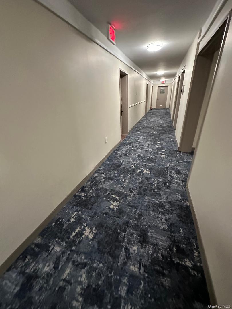 770 Shore Road, Unit 6EE Long Beach, NY 11561 - Photo 12 of 13 Corridor featuring baseboards
