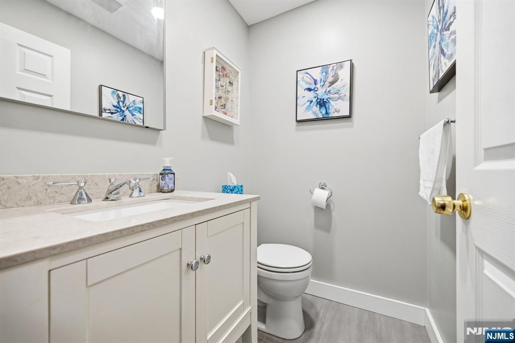 300 Coventry Court Ramsey, NJ 07446 - Photo 17 of 27 a bathroom with a toilet sink and mirror