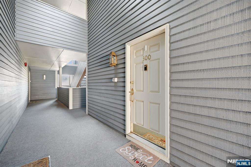 300 Coventry Court Ramsey, NJ 07446 - Photo 2 of 27 a view of a house with a door and wooden walls