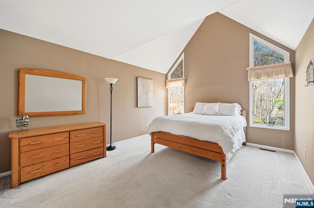 300 Coventry Court Ramsey, NJ 07446 - Photo 24 of 27 a bedroom with a bed and a dresser