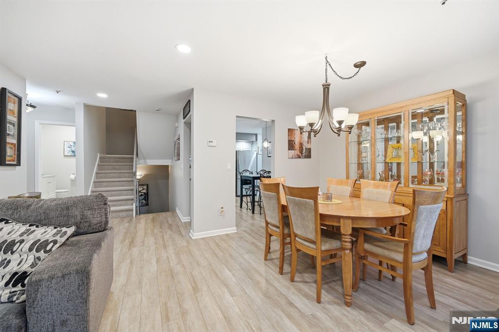 300 Coventry Court Ramsey, NJ 07446 - Photo 10 of 27 a view of a dining room with furniture and wooden floor
