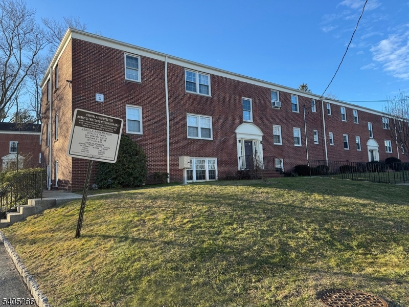 390 Morris Avenue, Unit 35 Summit, NJ 07901 - Photo 14 of 16 a brick building with a yard in front of it
