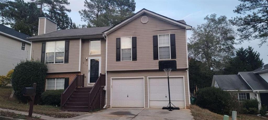 828 Tradd Court Stone Mountain, GA 30087 - Photo 1 of 1 a front view of a house with a yard