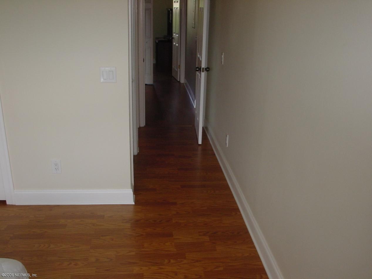 650 West Pope Road, Unit 252 St. Augustine, FL 32080 - Photo 19 of 33 a view of a hallway with wooden floor
