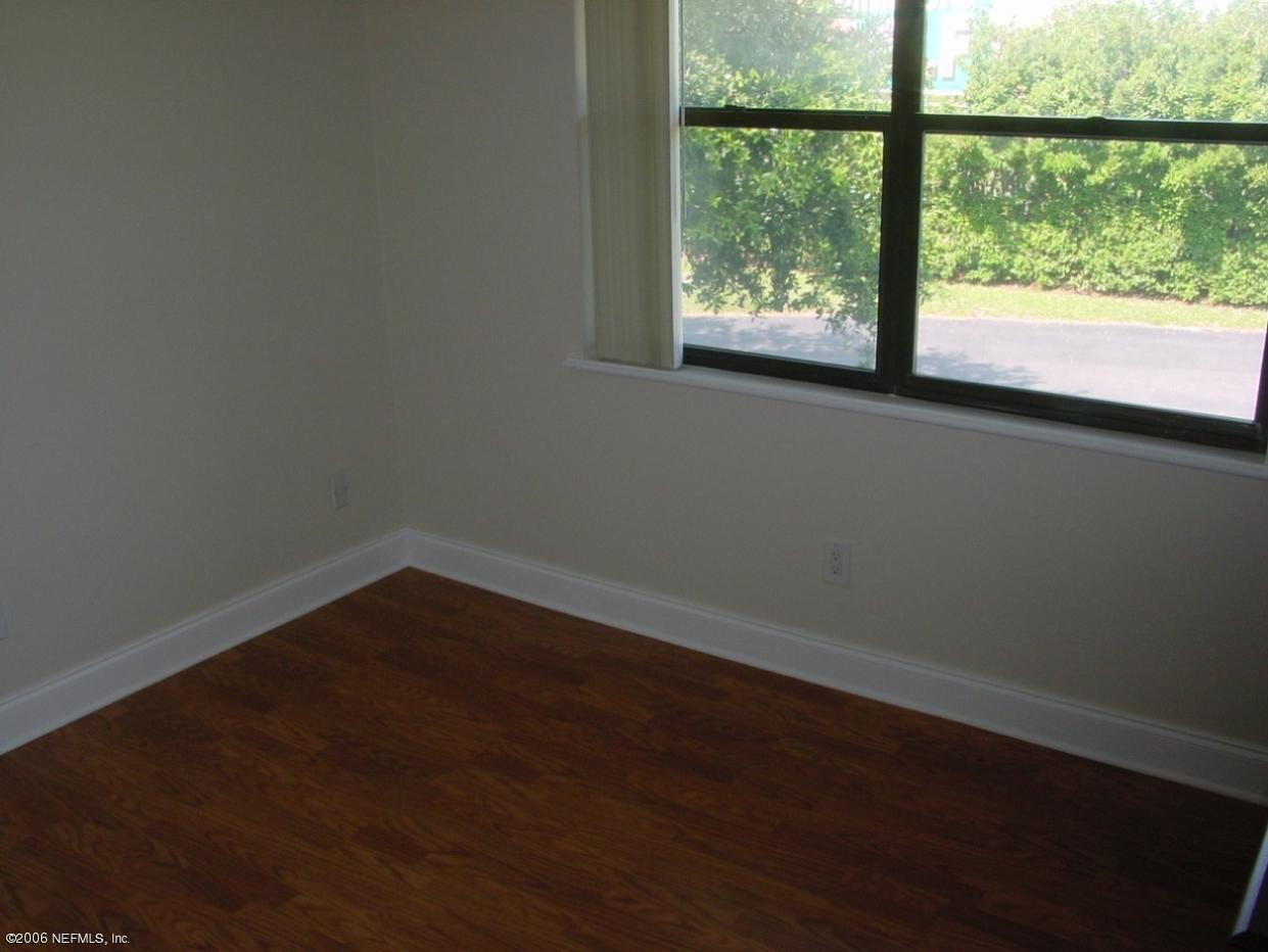 650 West Pope Road, Unit 252 St. Augustine, FL 32080 - Photo 21 of 33 a view of a small space with wooden floor and a window