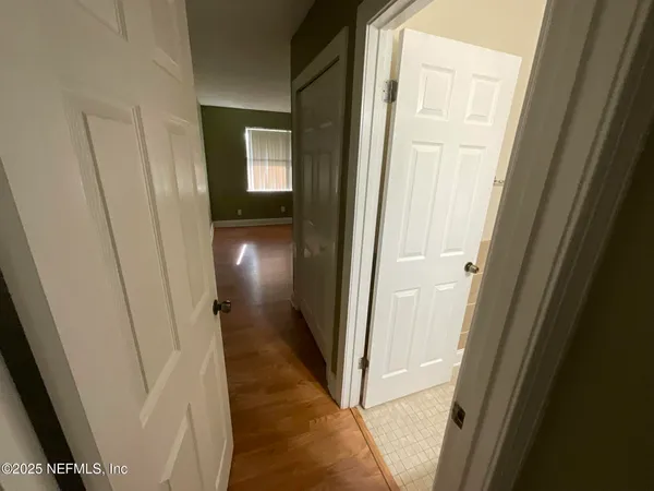 an empty room with wooden floor