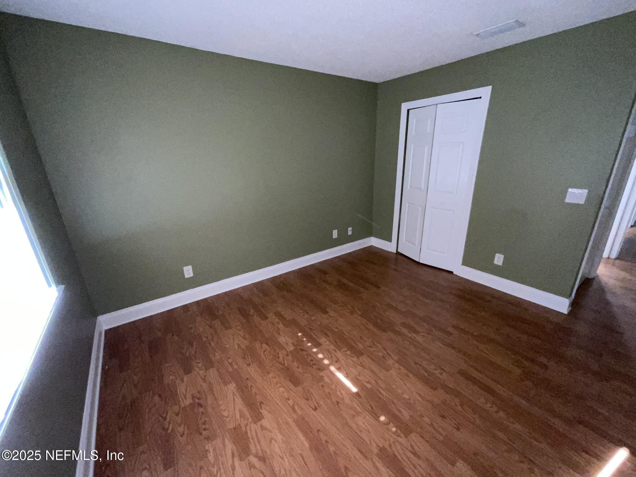 650 West Pope Road, Unit 252 St. Augustine, FL 32080 - Photo 31 of 33 an empty room with wooden floor