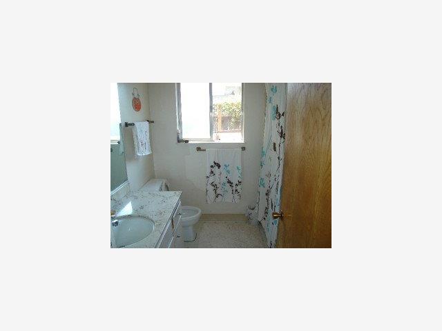 22374 McClellan Road Cupertino, CA 95014 - Photo 8 of 8 a bathroom with a sink and a shower