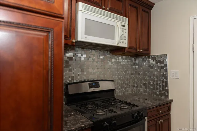 a bathroom with a stove and a microwave
