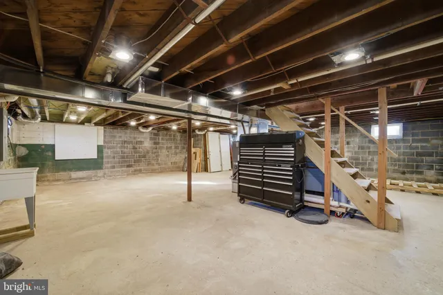 a view of empty room with wooden ceiling