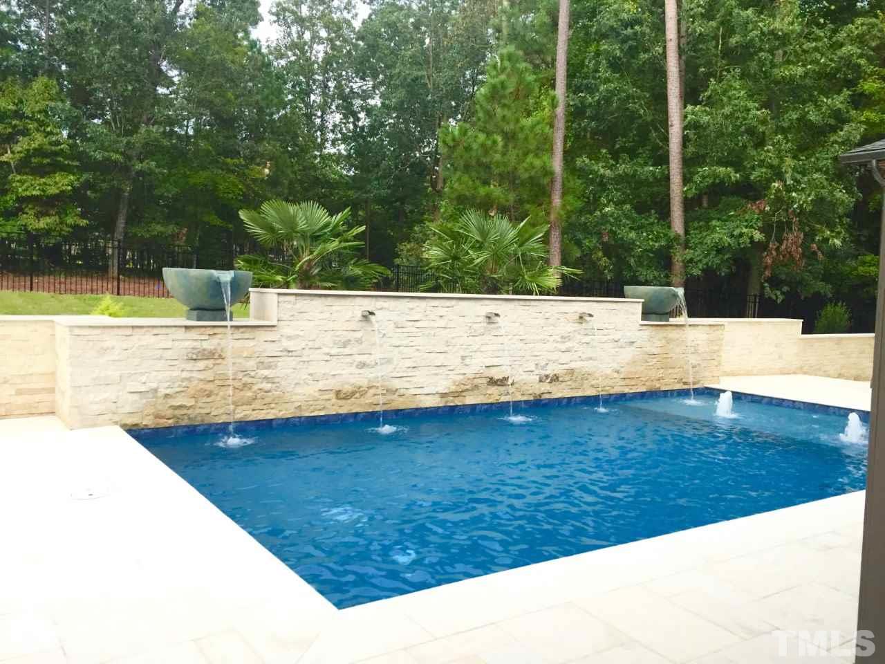 1024 Welch Lane Raleigh, NC 27614 - Photo 9 of 24 Enjoy The Relaxing View Of This Pool From Every Angle. Fountains And Tanning Shelf. The Relaxing Sound Can Be Enjoyed From The Family Room, Kitchen, Breakfast Room, Master Bedroom And The Guest Room or Office.