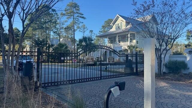I-14 Mallard Lane Santa Rosa Beach, FL 32459 - Photo 16 of 25 a front view of a house with a garden