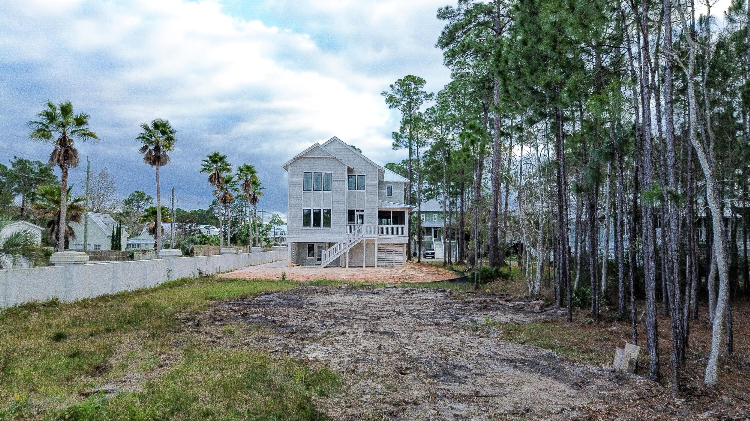 I-14 Mallard Lane Santa Rosa Beach, FL 32459 - Photo 9 of 25 a view of a house with backyard and sitting area